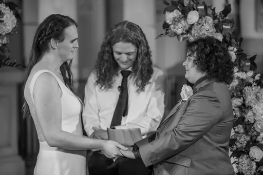 A black and white photo of Alexis, Christian, and Ryan